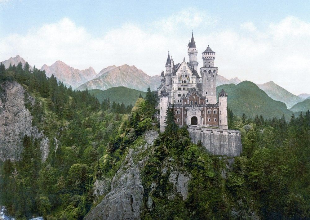 Neuschwanstein Castle on a cliff among Alpine peaks