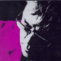 Silver Edition cover. A black-and-white face set at an angle on black, with a block of magenta on the left