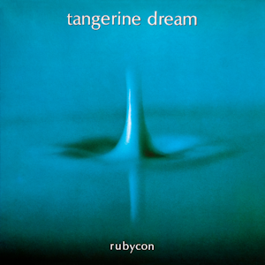 Rubycon album cover, a photograph of a single drop of water hitting a surface